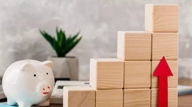 développement économique qui augmente, avec un graphique fait avec des cubes de bois