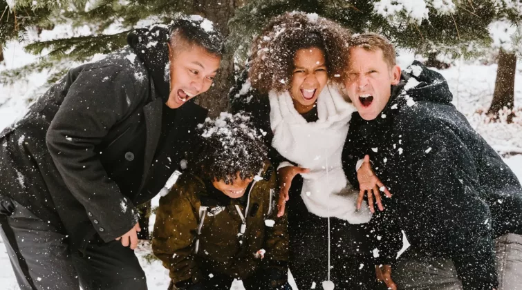 group of people standing on snowy field