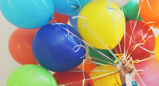 person holding balloons