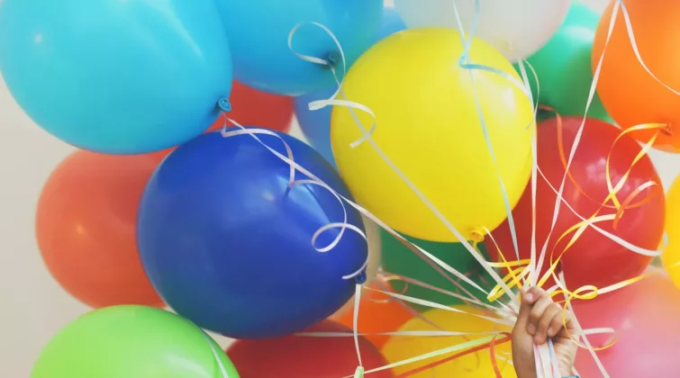 person holding balloons